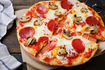 Italian Pizza with sausage and mushrooms