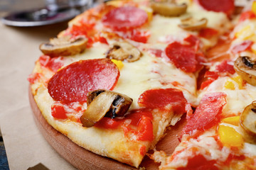 Italian traditional Pizza with sausage and mushrooms