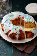 Glazed Easter cake on wooden table