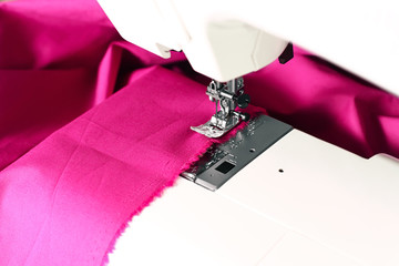 Sewing machine and a pink fabric