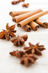 Pile of cinnamon and cloves on homemade canvas close up