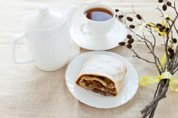 Still-life with apple pie, tea and dry branch
