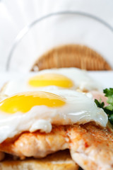 Fried eggs with toast and chicken