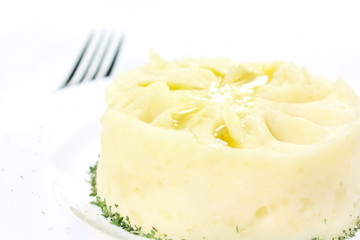 Mashed potatoes, poured melted butter