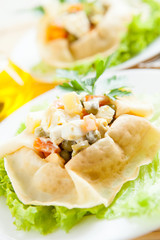 Vegetarian salad with cooked vegetables wrapped in a pancakes