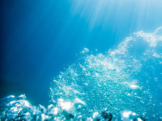 Bubbles underwater in tropical ocean. Water texture in sea