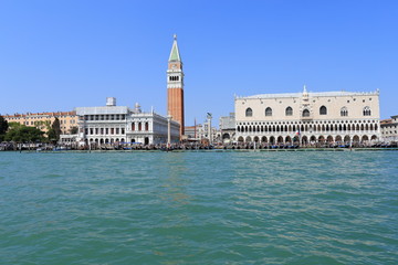 Fototapeta na wymiar VENICE - APRIL 9, 2017: The view on San Marco Square, Campanile and Doge Palace with tourists near the Doge Palace, on April 9, 2017 in Venice, Italy