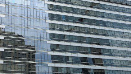 pattern glass window of office building with reflected.