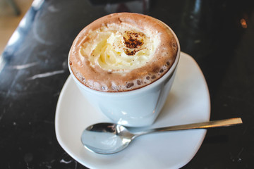 A nice coffee with  soft milk infornt .