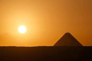 Fototapeta na wymiar landscape with sun rising at Great Pyramid of Giza