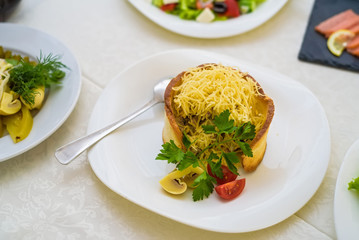 Warm salad with cheese in bread