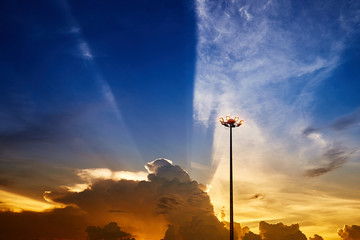 Spot-light pole against beautiful sunset sky