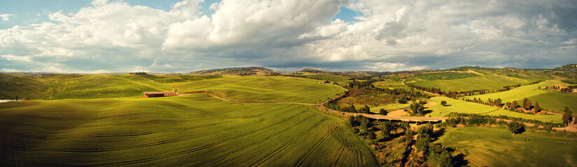Fototapeta na wymiar Tuscany countryside hills, stunning aerial view in spring.
