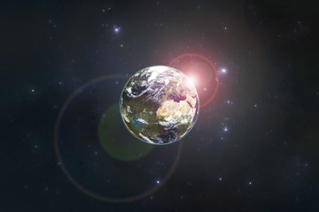 Planet Earth with the rising sun. Elements of this image furnished by NASA