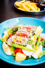 Raw and fresh tuna meat with sesame and salad