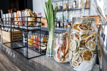 Dried grapefruit chips in the glass jar. Lemon, Lime