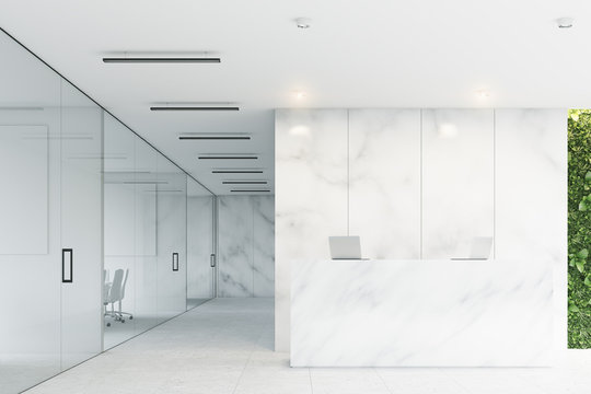 White reception, marble office, front
