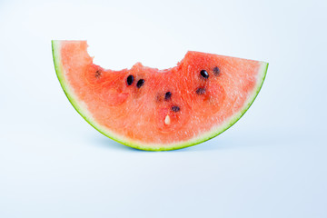 bitten watermelon slice on a white background