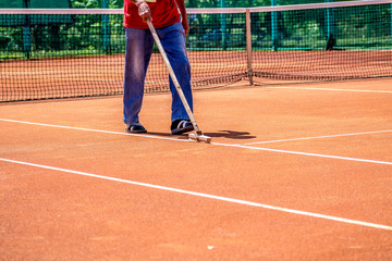 Preparation of a ground tennis court