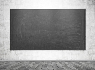 Blank blackboard in an empty classroom