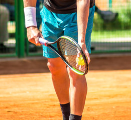 Fototapeta na wymiar Tennis player gives the ball