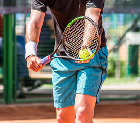 Tennis player gives the ball