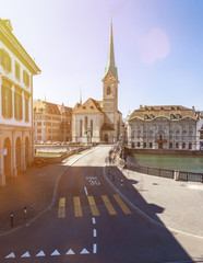 View of the famous Fraumunster Church and munsterbrucke with river Limmat on a sunny day with blue sky, Canton of Zurich, Switzerland