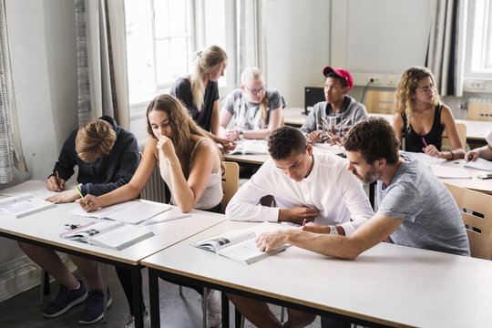 Teacher and students (14-15) in classroom