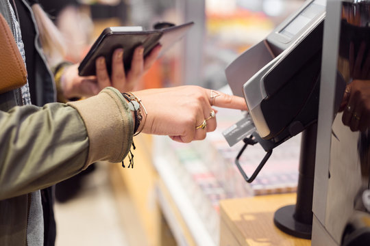 Woman paying with card credit