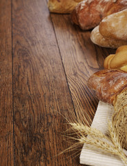 Bread loafs on wood background