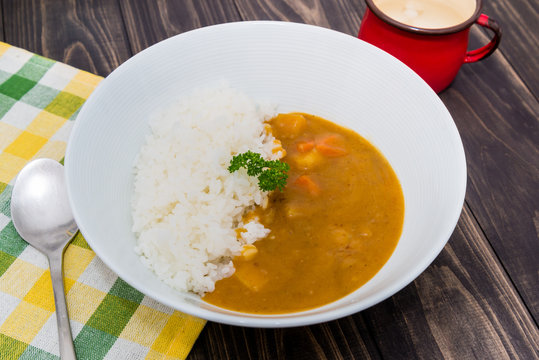 Japanese curry rice on vintage wooden table