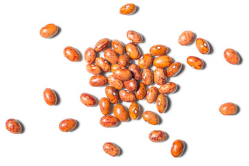 uncooked pinto beans on white, top view