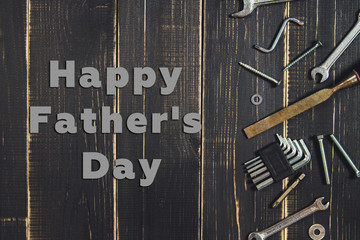 Joinery tools on a dark wooden table. Place for the text. A concept for Father's Day.