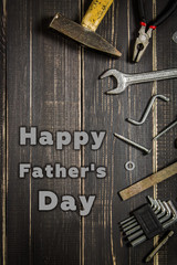 Joinery tools on a dark wooden table. Place for the text. A concept for Father's Day.