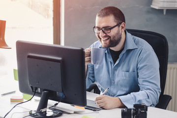 Illustrator At Work/ Young businessman at office.