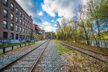 Fototapeta premium Railroad tracks and old buildings in Brattleboro, Vermont.