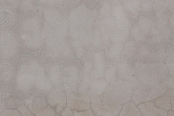 Gray wall with cracks