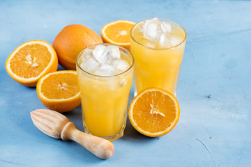 Glass of orange juice with ice cubes Cold orange fresh Glass of orange juice for hot summer day