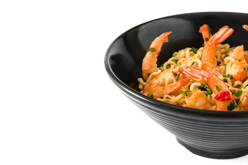 Noodles and shrimps with vegetables in black bowl isolated on white background

