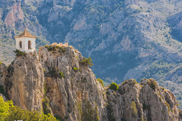Fototapeta na wymiar Bell tower of Guadalest castle on top of the rock,Spain