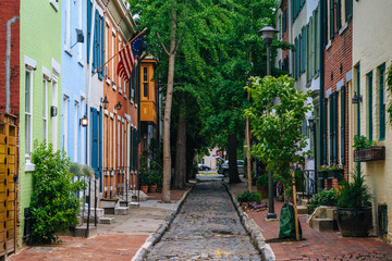 Fototapeta na wymiar Colorful row houses along Panama Street near Filter Square, Philadelphia, Pennsylvania.