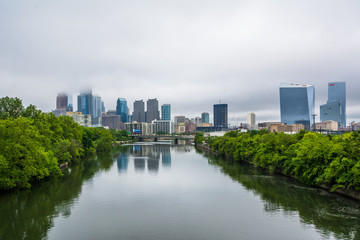 Fototapeta na wymiar Foggy view of the Philadelphia skyline and Schuylkill River in Philadelphia, Pennsylvania.