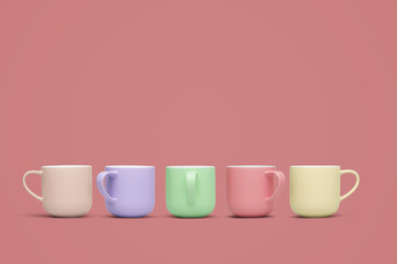 Colored cups on a coral color background