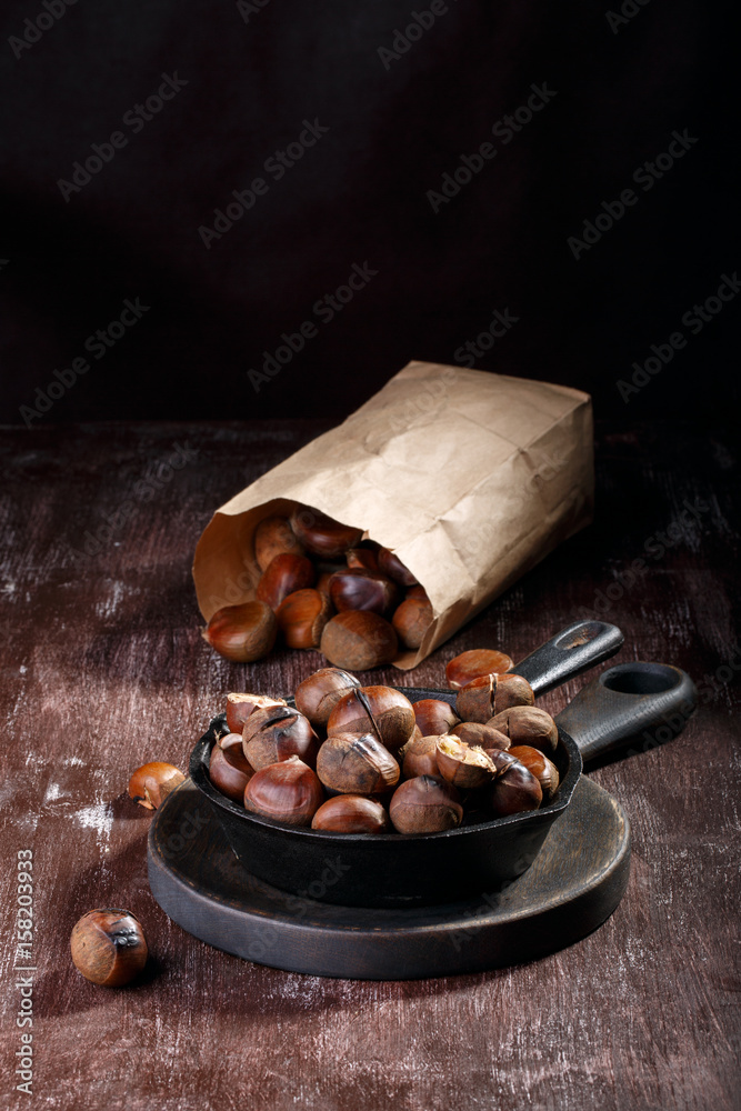 Wall mural roasted edible chestnuts