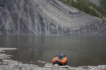 The outcrop of rocks in the river. The shown folding and tectonics. The Indigirka river, Sakha...