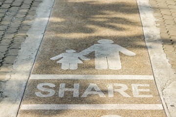 Symbol of share people on walkway