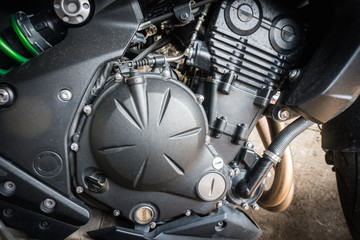 Detail of modern motorcycle engine with stain from raindrop. Select focus