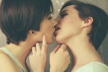 Young lesbian couple kissing, closeup