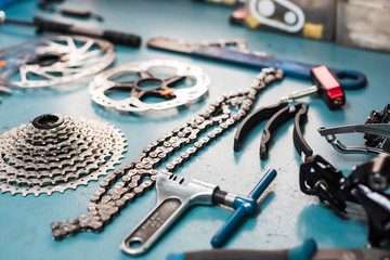 Closeup of metal details for bicycle lying on the table