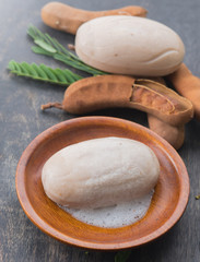 Tamarind soap with Tamarind pods on wood background